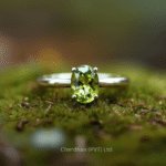Elegant solitaire peridot ring made from sterling silver displayed on a natural background.