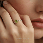 Standing peridot ring photographed in natural light showing fine craftsmanship and detail.