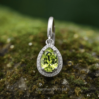 Pair of stunning teardrop peridot earrings set in polished sterling silver, featuring brilliant American diamond accents, displayed on a white background.